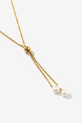 Colgante dorado con perla