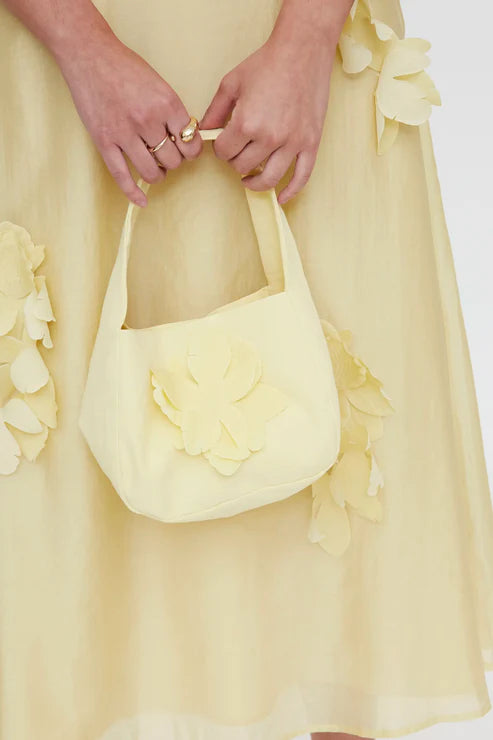 Bolso de mano amarillo claro